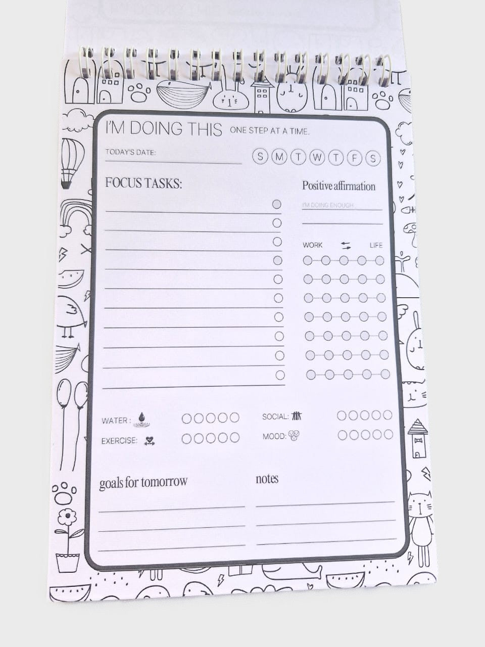 Daily planner notepad inside page with schedule, priorities, tasks, mood and hydration tracker.