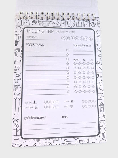 Daily planner notepad inside page with schedule, priorities, tasks, mood and hydration tracker.