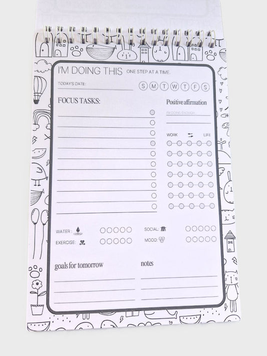 Daily planner notepad inside page with schedule, priorities, tasks, mood and hydration tracker.