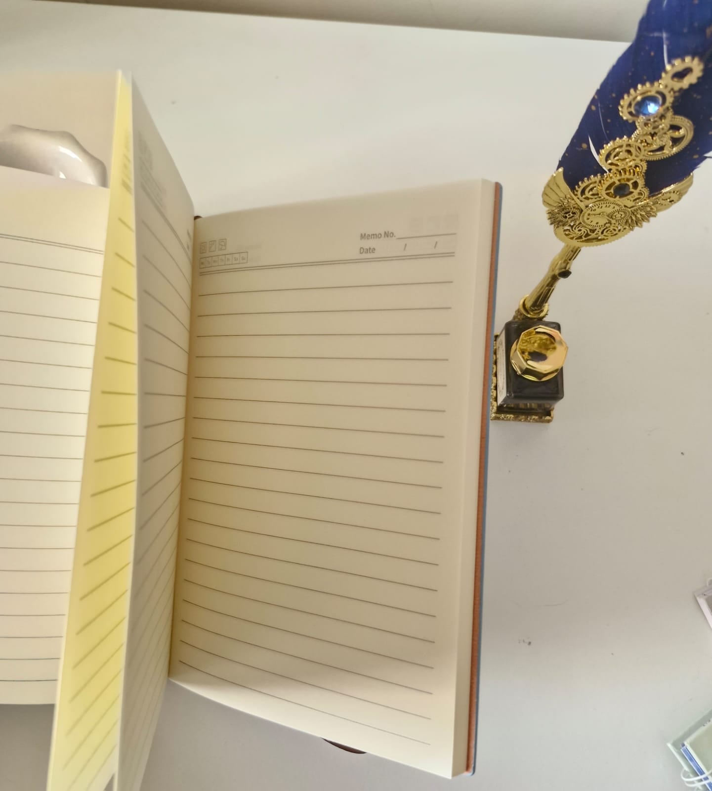 Angled view of an undated soft cover diary highlighting page thickness and ivory paper quality