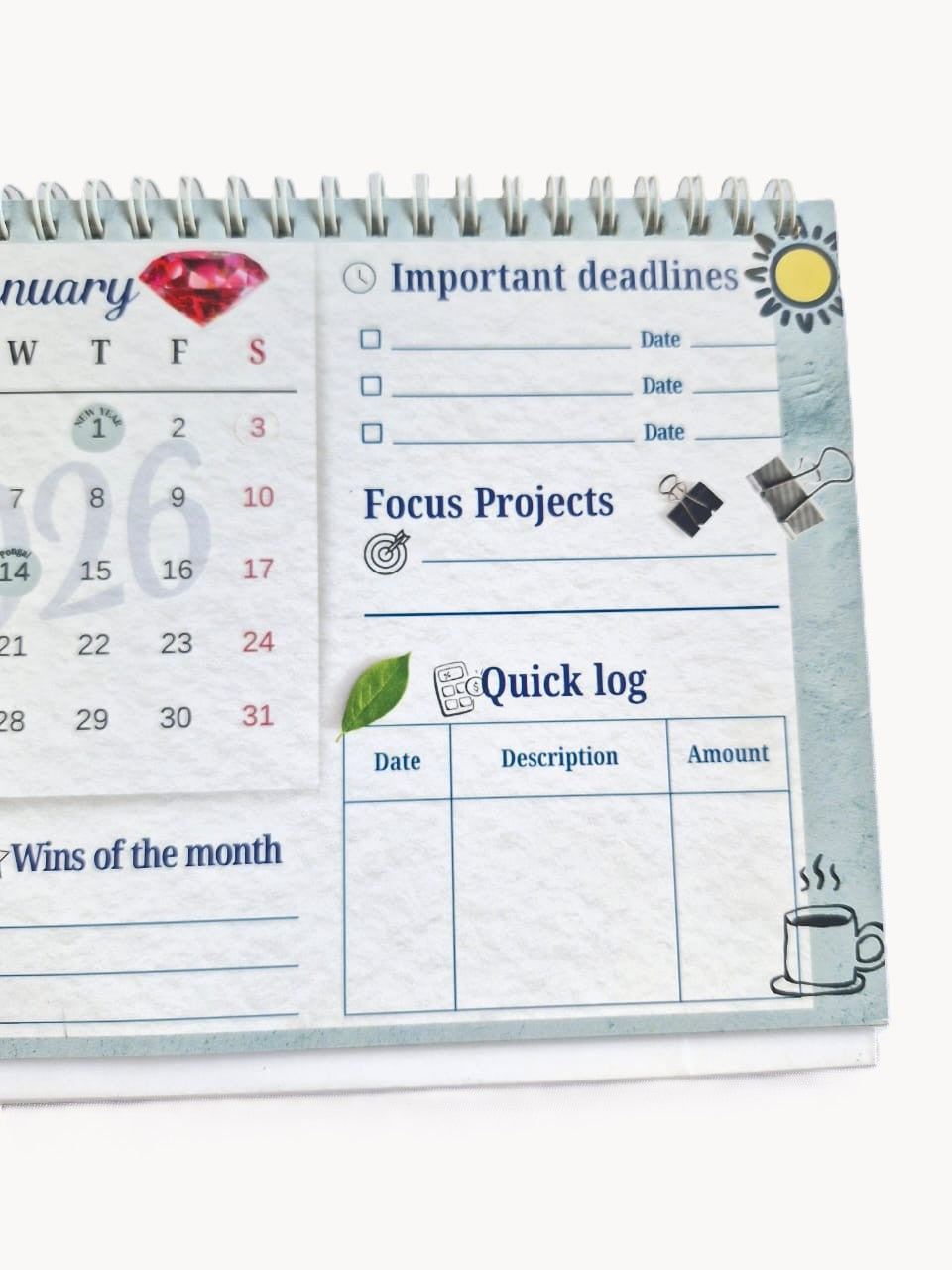 Navratna desk calendar placed on a table with minimal workspace accessories.