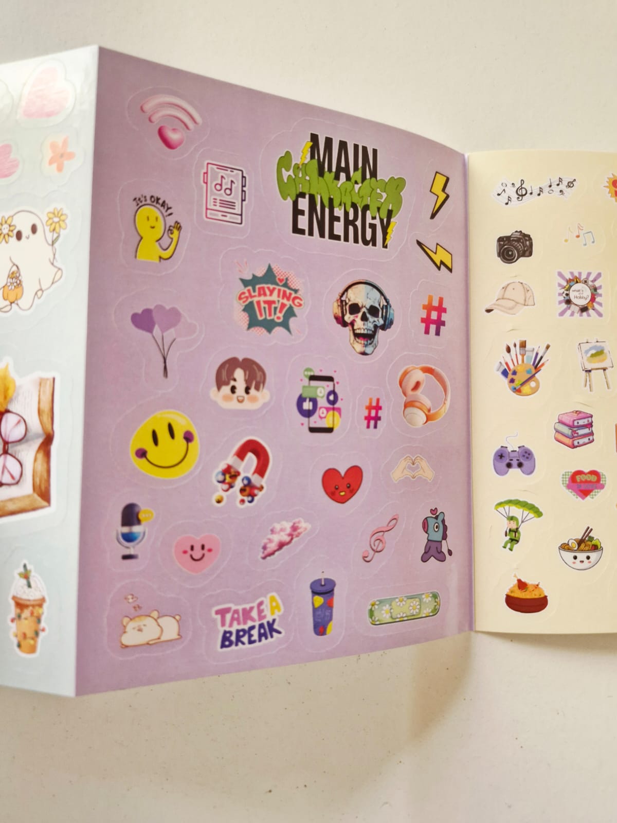 Sticker book opened showing multiple sticker designs